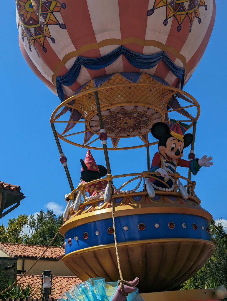 Parade float from Festival of Fantasy Parade featuring Mickey and Minnie Mouse. 